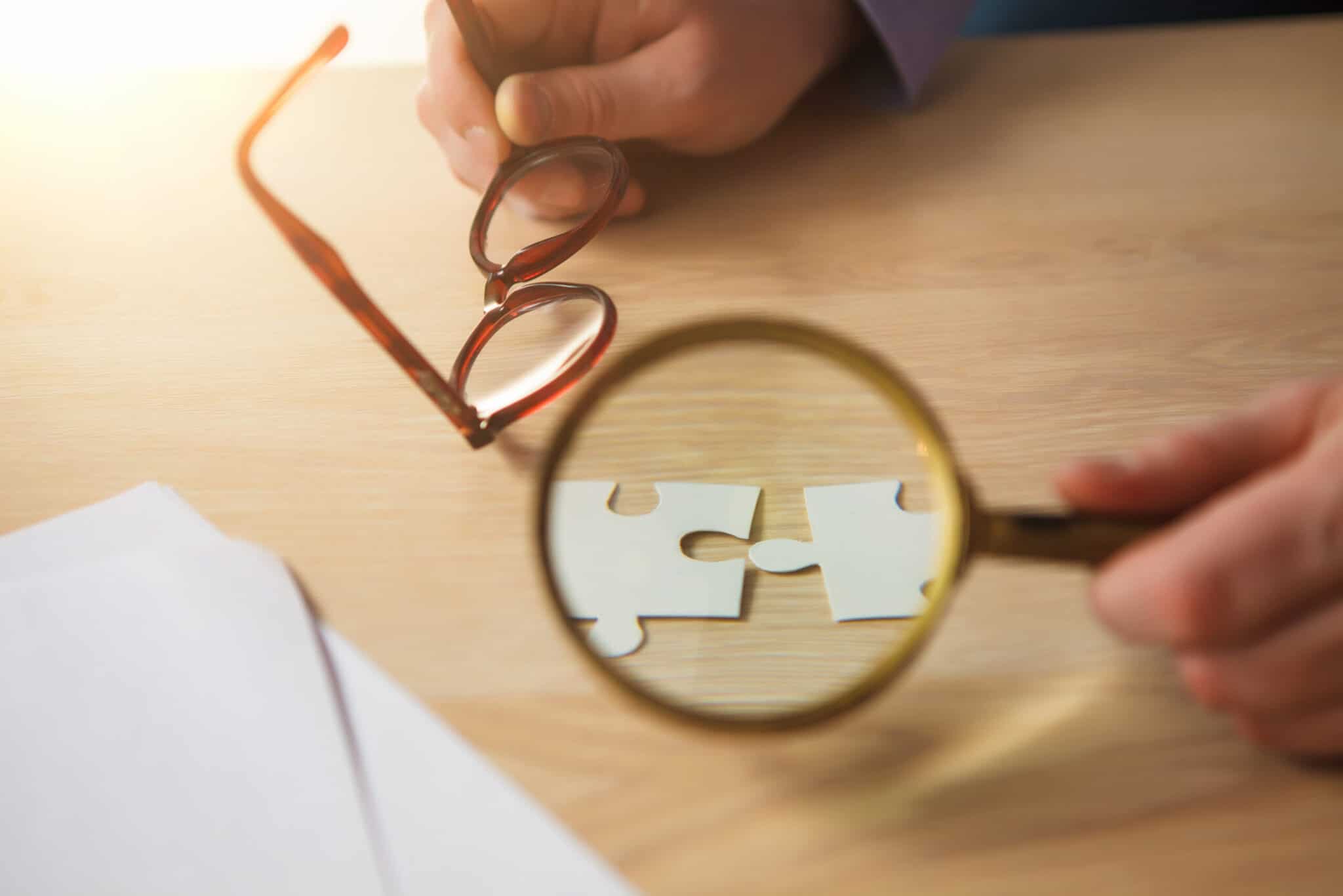 Building a business success. The hands with puzzles